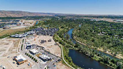 Fototapeta na wymiar aerial view of Boise, Idaho's Barber Park with multiple construction projects in the summer next to the Boise, River