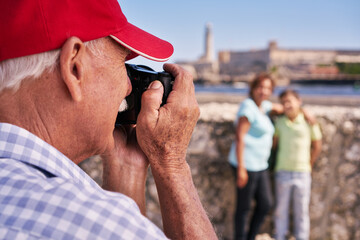 Happy tourists on holidays. Hispanic people traveling in Havana, Cuba. Grandfather, grandmother and...
