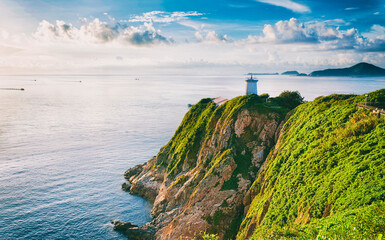 Fototapeta na wymiar Hong Kong lighthouse during sunrise , Hok Tsui Cape D'Aguilar beautiful landscape