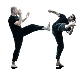 two caucasian men krav maga fighters fighting isolated silhouette on white background