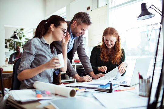 Coworkers working on a project in a startup company office