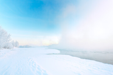 Morning fog on the river in winter