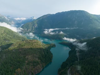 Fototapeten Rugged, forest-covered landscape surrounds Diablo Lake in North Cascades National Park. This mountainous region of northern Washington is absolutely beautiful and easily accessed during summer months. © ead72