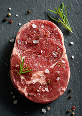 Fresh raw steak with salt and pepper