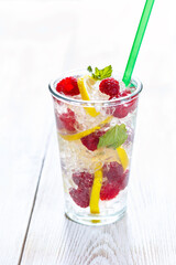 Fresh summer fruit detox iced water with raspberry and lemon.