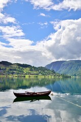 Single rowboat in a fjord in Ulvik, Norway. Beautiful scenery.