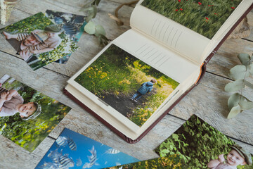Printed photos in family picture album. Photo printing concept. 