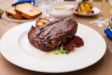 Entrecote with grilled garlic served on a plate