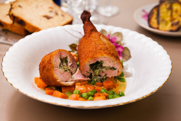 Chicken kiev with stewed carrots and beans
