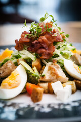 Caesar salad with chicken and greens on a plate