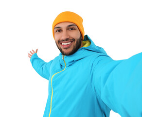 Smiling young man taking selfie on white background