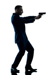 one caucasian man with a handgun silhouette isolated on white background