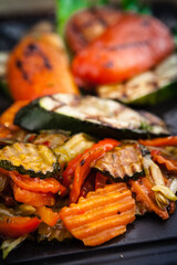 Grilled vegetables, baked in coal oven served on a warm plate
