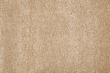 Soft beige carpet as background, top view