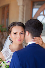Fototapeta premium Funny bride and groom on a summer day in the park