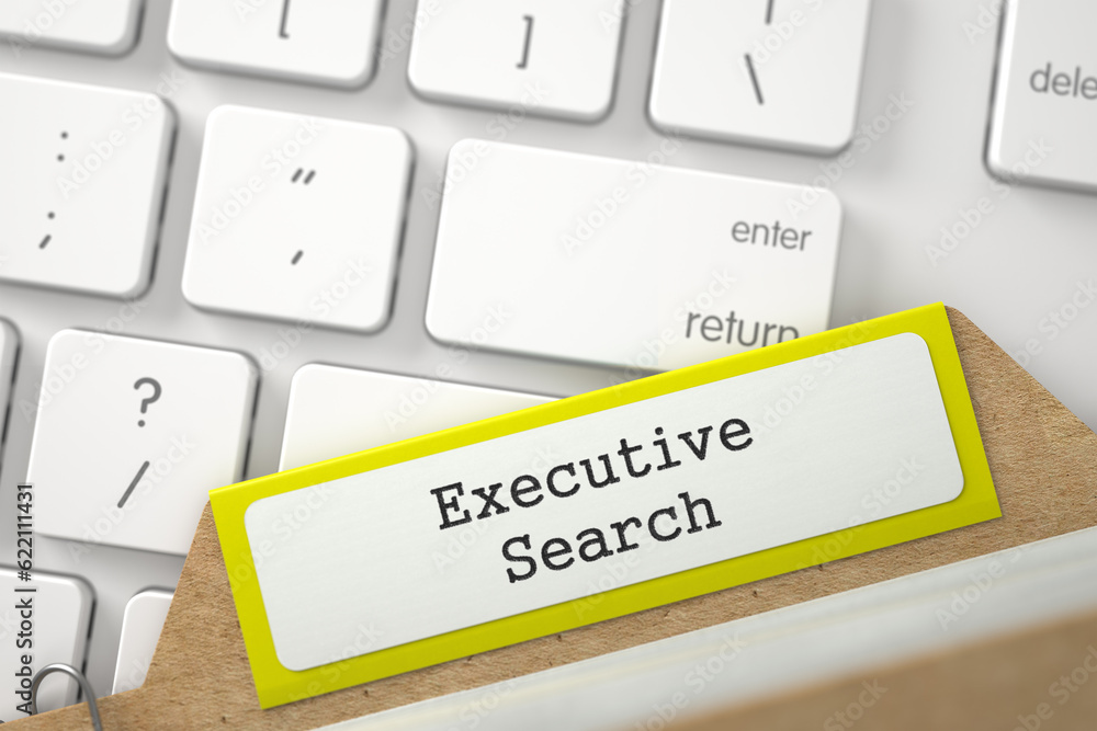 Poster executive search. yellow index card lays on white modern computer keyboard. business concept. close 