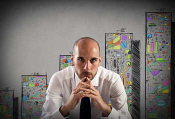 Confident businessman with statistical sketch on background