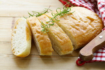 traditional Italian ciabatta bread on a wooden table