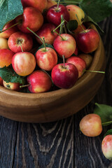 Naklejka na ściany i meble Fresh harvest of apples an a wooden background, nature fruit concept