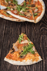 Pizza with chicken mushrooms and rukkola