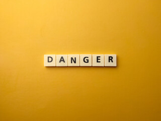 Top view toys letters with the word DANGER