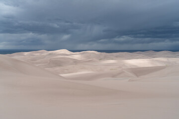 Fototapeta na wymiar Sand dunes with patches of light in Colorado