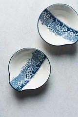 Deurstickers white and blue tempura sauce bowl with a floral pattern, hand painted minimalist sauce bowl, Japanese style dinnerware on a minimalist background © this_baker