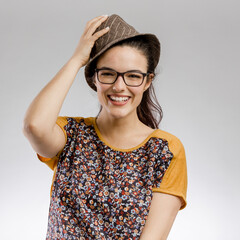 Portrait of a happy woman wearing a hat and smilling