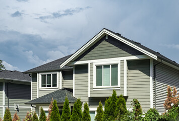 Facade of new residential townhouses. Top of a modern complex of apartment buildings. Real Estate...
