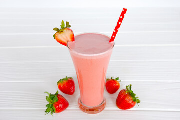 Strawberry yogurt fruit juice smoothie pink colorful fruit juice milkshake blend beverage healthy high protein the taste yummy In glass drink episode morning on white wood background.