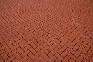 Sidewalk, paved with red tiles. Beautiful background