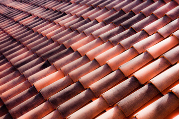 Repeating terracotta tiles on a roof in Italy