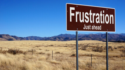 Frustration road sign with blue sky and wilderness © Designpics