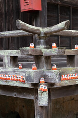 A vibrant image showcasing a crowd of Darumas in the streets of Osaka, Japan. A colorful and culturally rich representation of this iconic Japanese tradition. Perfect for projects related to Japanese