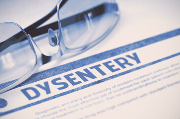 Diagnosis - Dysentery. Medicine Concept with Blurred Text and Eyeglasses on Blue Background....