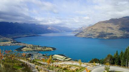 view of lake from the mountains in queenstown, new zealand