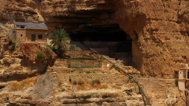 Aerial: Drone Panning Shot Of Monastery Of Saint George Of Choziba On Cliff - Judaean Desert, Israel
