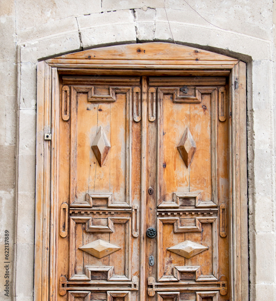 Wall mural wooden traditional old door and wall