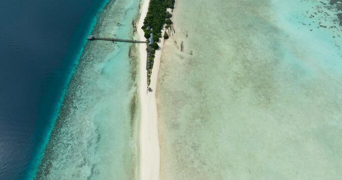 Aerial drone of sandy beach and coral reef. Sandbar and atoll. Timba Timba islet. Tun Sakaran Marine Park. Borneo, Sabah, Malaysia.