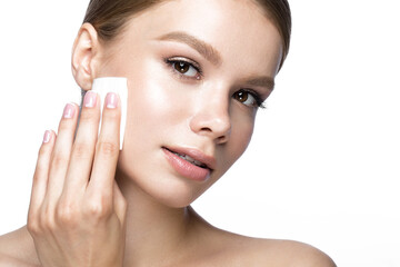 Beautiful young girl with wipes for removing makeup and French manicure. Beauty face. Picture taken...