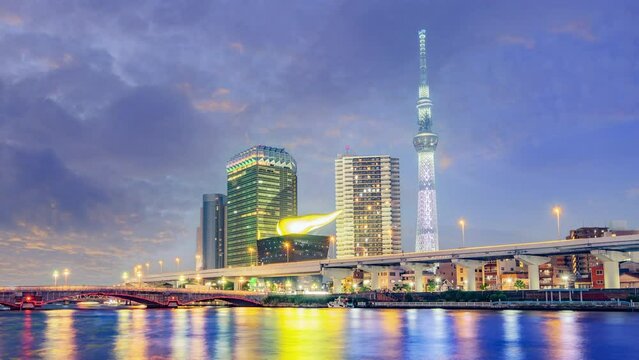 Cityscape of Tokyo skyline, timelapse video of office building at Sumida river in the evening. Japan, Asia.