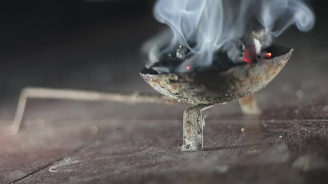 SHOT OF SMOKE ND FOG OF LOBHAN COMING FROM A LOBHAN DANI ON THE FLOOR. HD - FOOTAGE - CINEMATIC