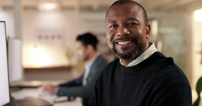 Happy, mature businessman and working on computer, desk and office for marketing, communication or consultant in crm. Portrait, employee with pride or success in consulting agency or business