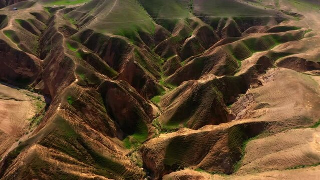 Aerial Tilt Down Shot Of Hills And Mountain Ranges On Sunny Day, Drone Flying Forward Over Natural Landscape - Nabi Musa, Israel