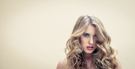 Beautiful girl with a colorful makeup and nice hairstyle