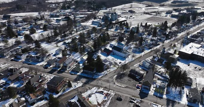 Sunny mid afternoon winter aerial video of Tully, NY, USA.