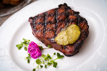 New York steak with herb butter on a plate