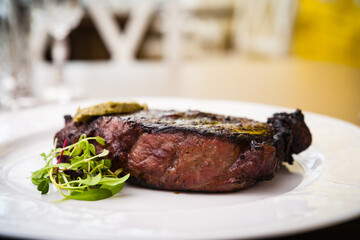 New York steak with herb butter on a plate