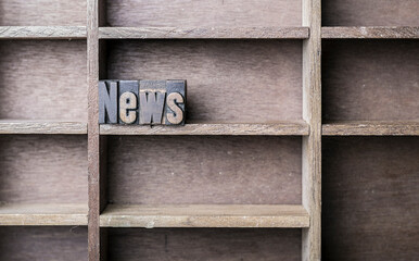 old wooden printers type forming the word News