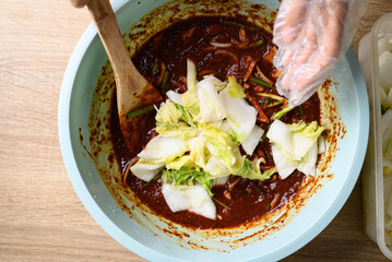 Korean food, Kimchi cabbage cooking with hand, Homemade fermented side dish